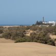 Dunas y Faro de Maspalomas en la costa sur de Gran Canaria